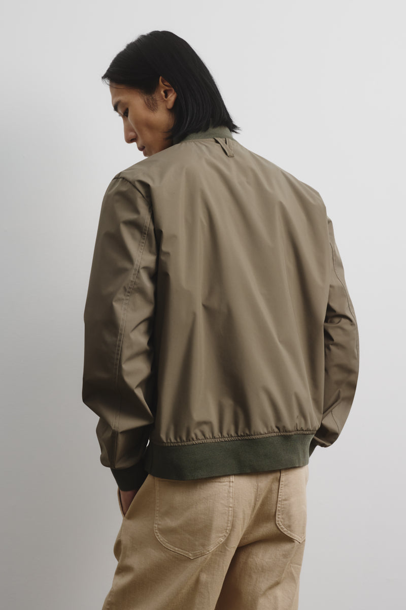 Packable Vasltarino in 3 layer microfiber, waterproof. Green - Caper