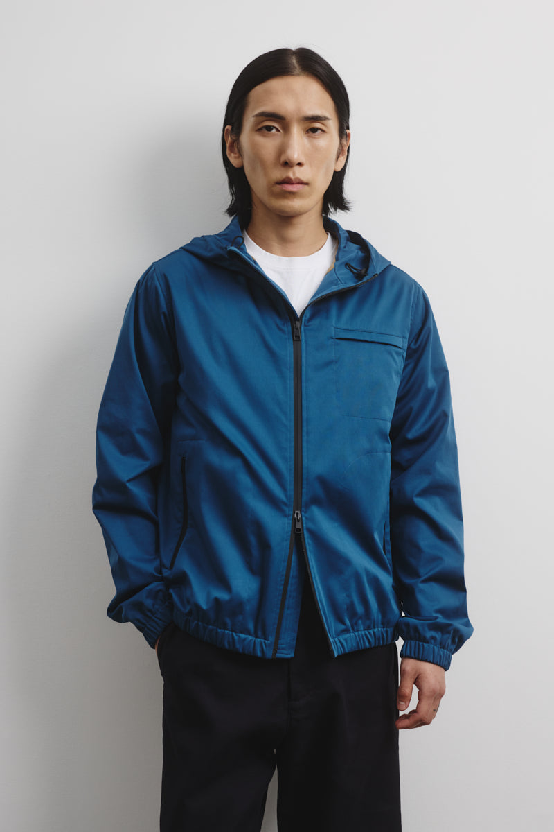 Hooded zip jacket in 2 layer bonded techno fabric. Lined. Blue - Ottan